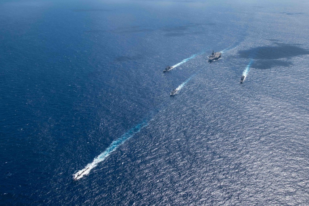 USS Ronald Reagan (CVN 76) sails in formation with HMAS Perth during Talisman Sabre 23