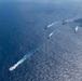 USS Ronald Reagan (CVN 76) sails in formation with HMAS Perth during Talisman Sabre 23