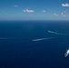 USS Ronald Reagan (CVN 76) sails in formation with HMAS Perth during Talisman Sabre 23