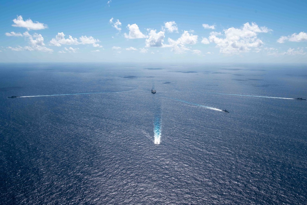 USS Ronald Reagan (CVN 76) sails in formation with HMAS Perth during Talisman Sabre 23