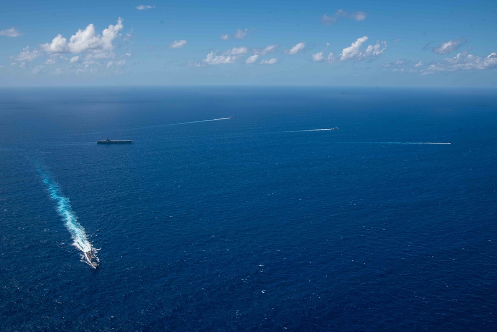 USS Ronald Reagan (CVN 76) sails in formation with HMAS Perth during Talisman Sabre 23