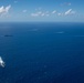 USS Ronald Reagan (CVN 76) sails in formation with HMAS Perth during Talisman Sabre 23