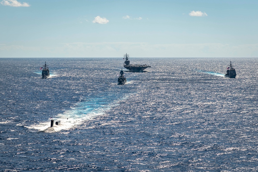 USS Ronald Reagan (CVN 76) sails in formation with HMAS Perth during Talisman Sabre 23