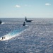 USS Ronald Reagan (CVN 76) sails in formation with HMAS Perth during Talisman Sabre 23