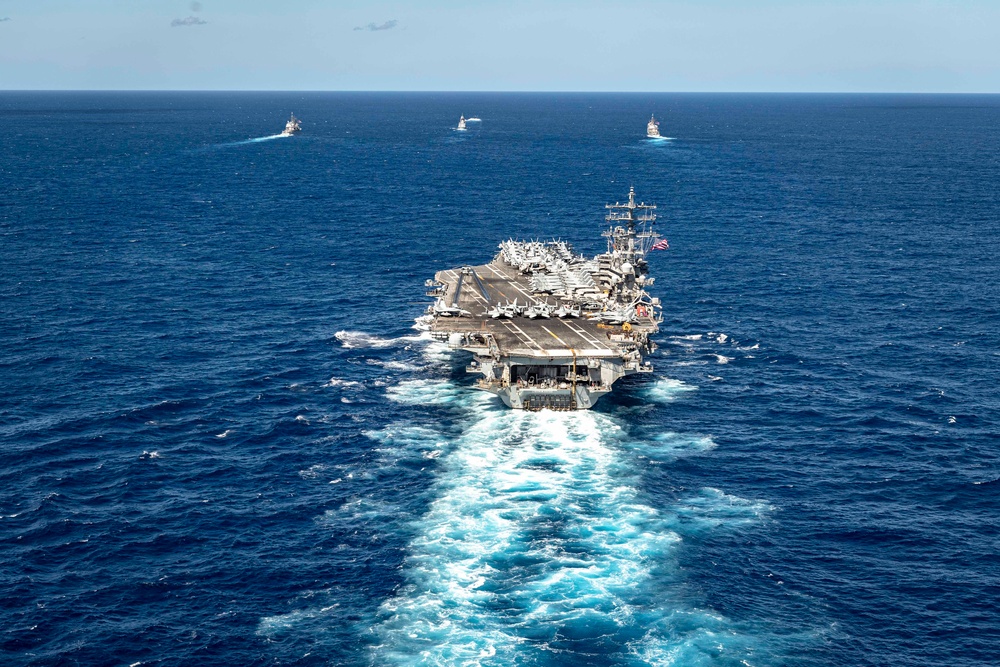 USS Ronald Reagan (CVN 76) sails in formation with HMAS Perth during Talisman Sabre 23