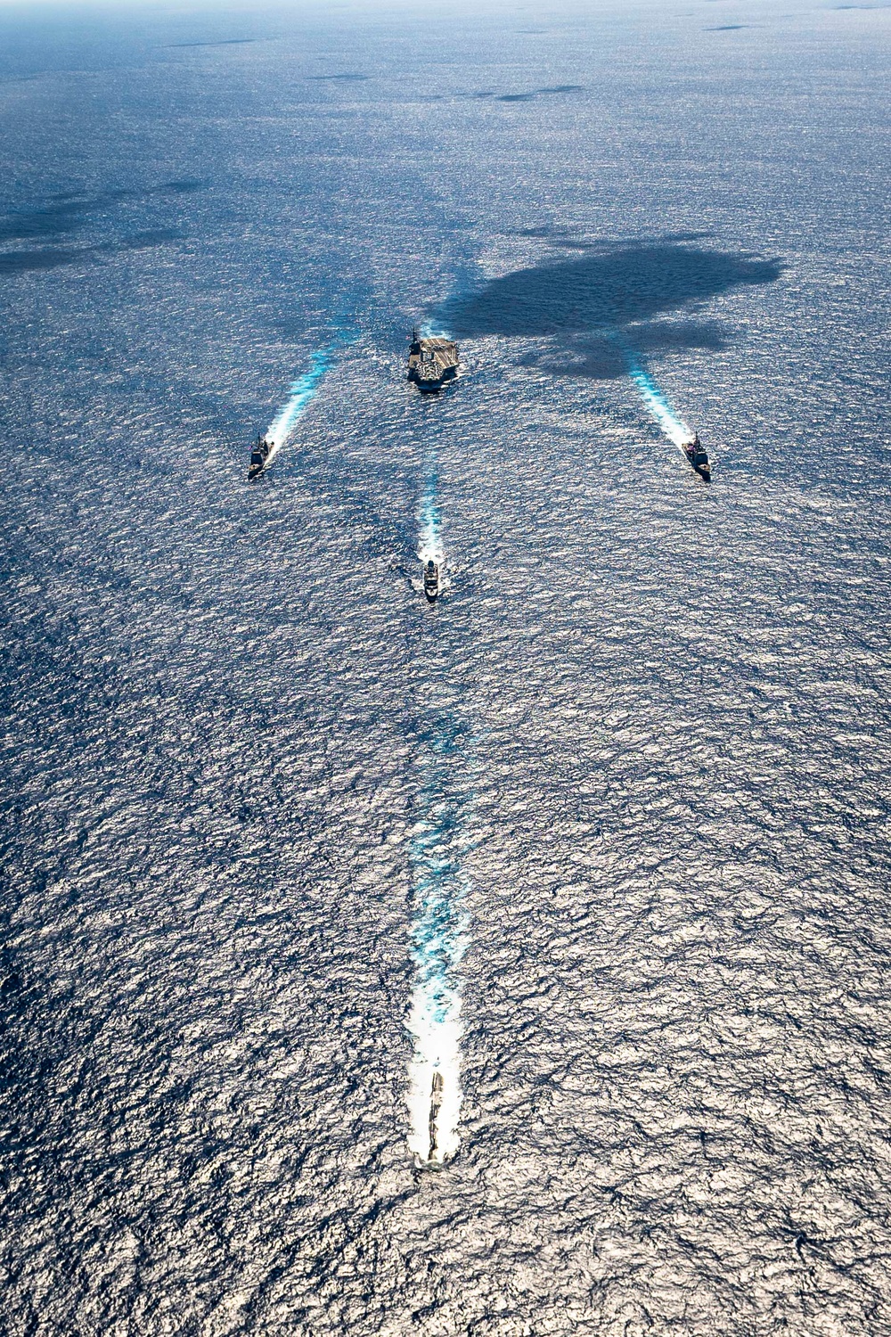 USS Ronald Reagan (CVN 76) sails in formation with HMAS Perth during Talisman Sabre 23