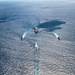 USS Ronald Reagan (CVN 76) sails in formation with HMAS Perth during Talisman Sabre 23