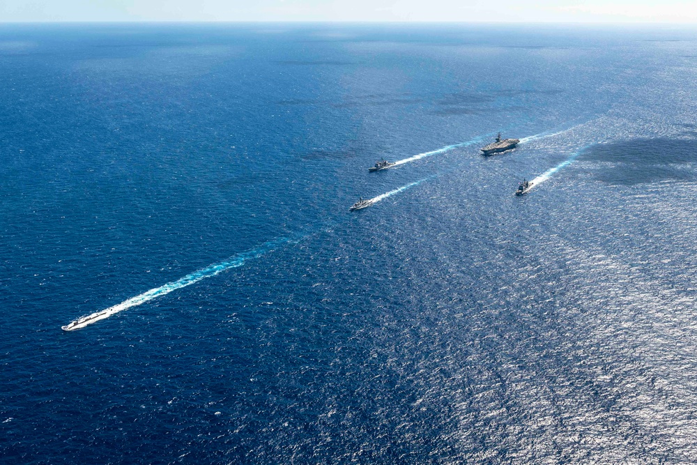 USS Ronald Reagan (CVN 76) sails in formation with HMAS Perth during Talisman Sabre 23