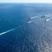 USS Ronald Reagan (CVN 76) sails in formation with HMAS Perth during Talisman Sabre 23