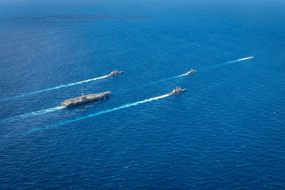 USS Ronald Reagan (CVN 76) sails in formation with HMAS Perth during Talisman Sabre 23