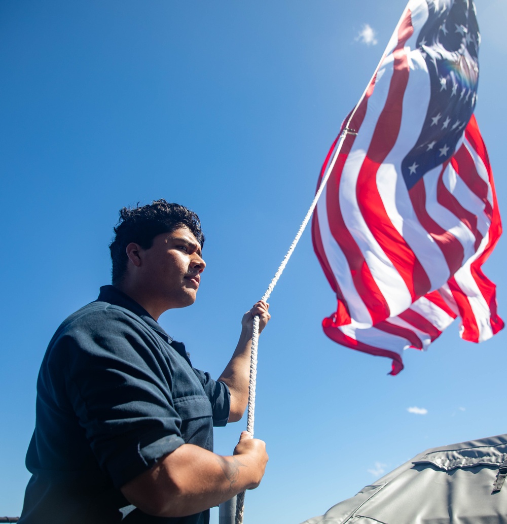 QM2 Flores Hoists the Ensign Aboard USS Antietam (CG 54) During Talisman Sabre 23