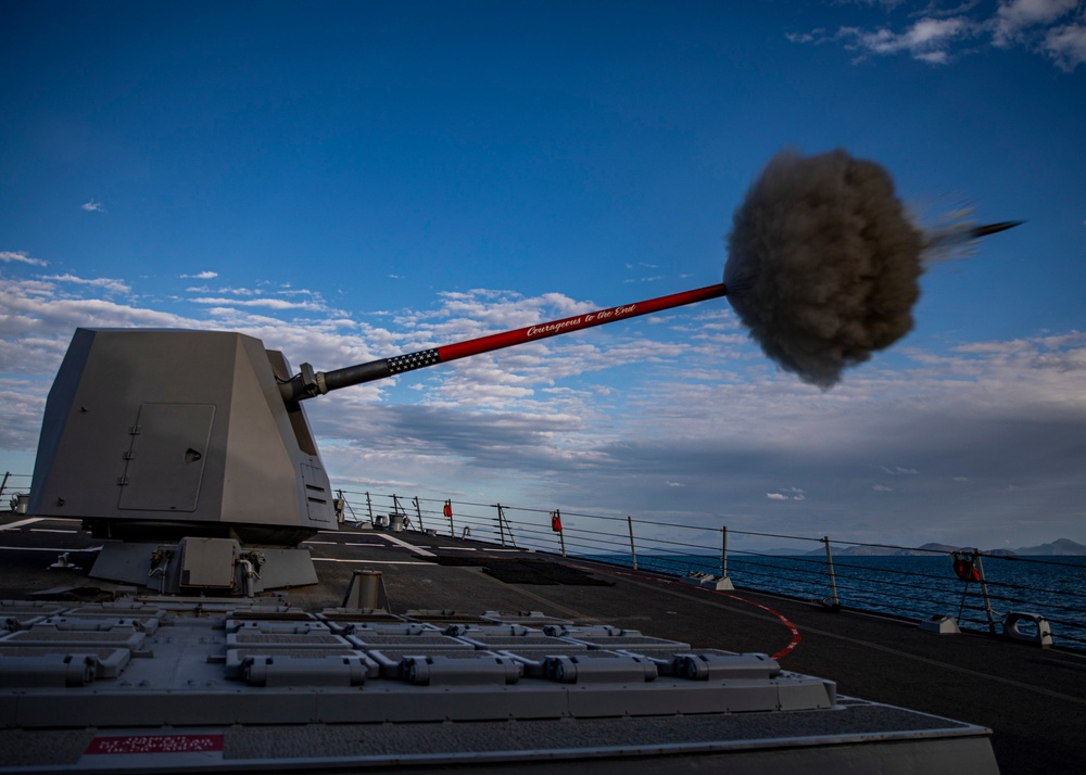 USS Rafael Peralta (DDG 115) fires a Mark 45 5-inch gun during a live fire exercise