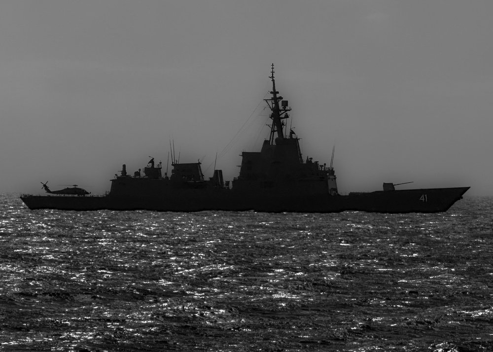 USS Rafael Peralta (DDG 115) transits in formation with the Royal Australian Navy Hobart-class destroyer HMAS Brisbane (DDG 41)