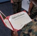 Assistant Commandant of the Marine Corps Gen. Eric M. Smith reenlists Cpl. Haley Dominguez