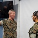 Assistant Commandant of the Marine Corps Gen. Eric M. Smith reenlists Cpl. Haley Dominguez