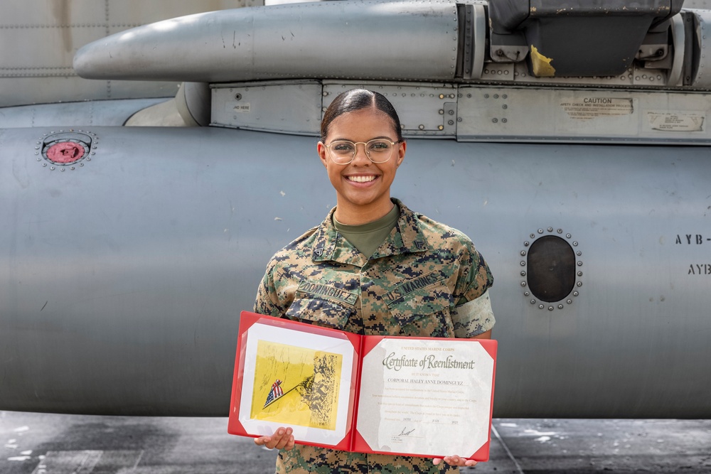 Assistant Commandant of the Marine Corps Gen. Eric M. Smith reenlists Cpl. Haley Dominguez