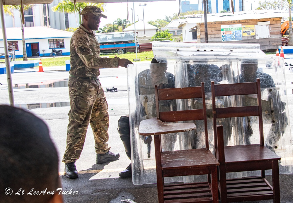 Royal Bermuda Regiment instructors train the Guyana Police Service on Public Order Riot Training during TRADEWINDS 23