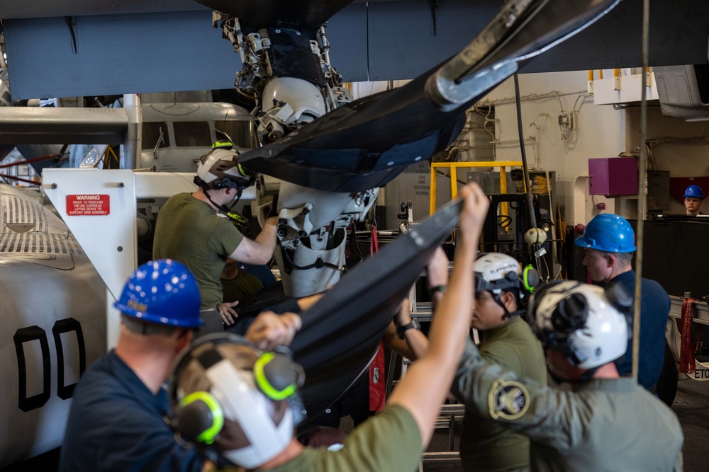 USS Bataan Sailors and 26th MEU Marines perform maintenance