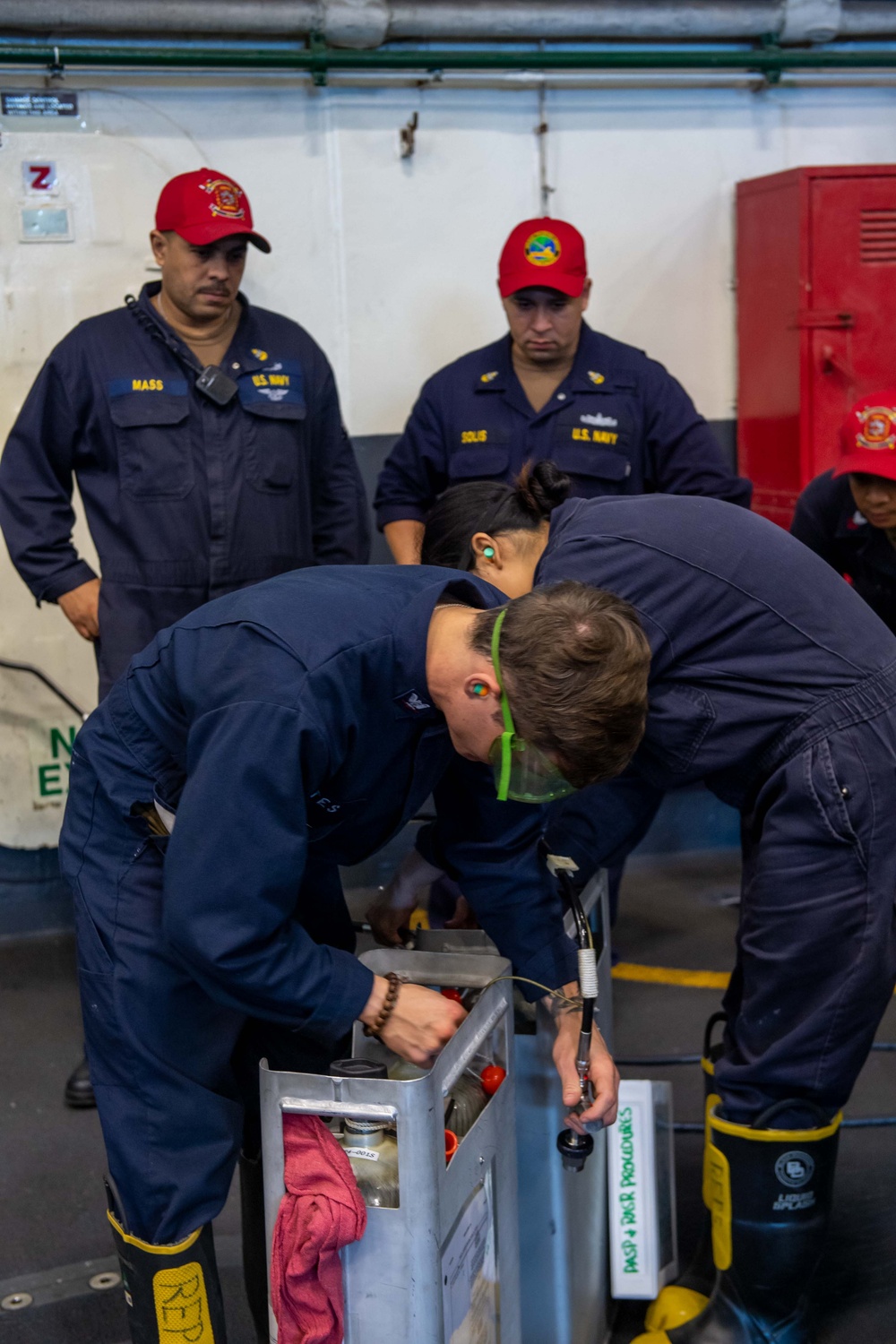USS Ronald Reagan (CVN 76) Sailors conduct flying squad drills