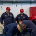 USS Ronald Reagan (CVN 76) Sailors conduct flying squad drills