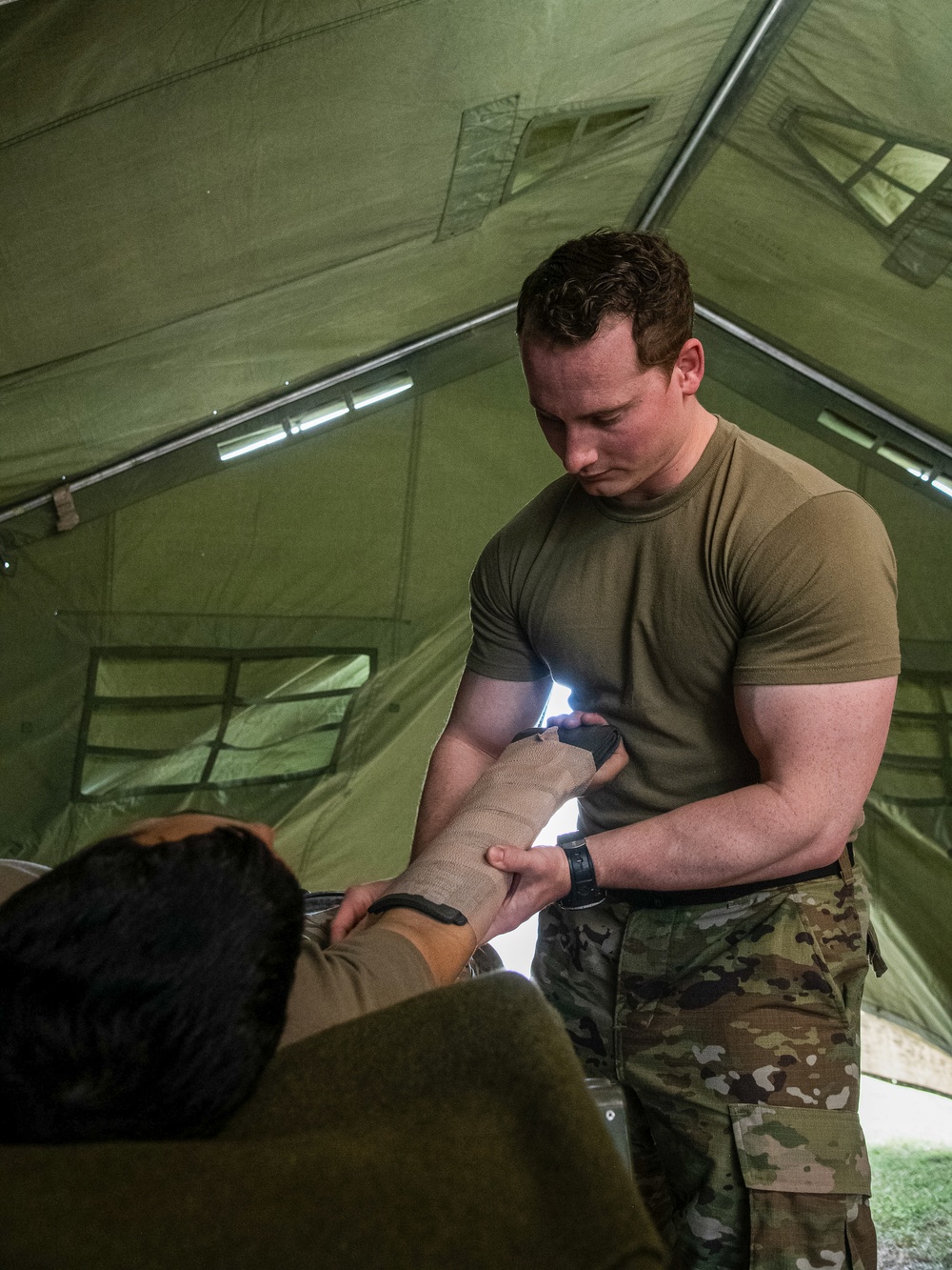 Soldiers of the 144th Area Support Company, Utah National Guard, provide real-world medical support during Talisman Sabre