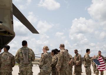 Reserve Soldier Reenlist inside of a CH-47 Chinook helicopter
