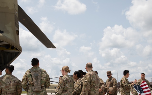 Reserve Soldier Reenlist inside of a CH-47 Chinook helicopter