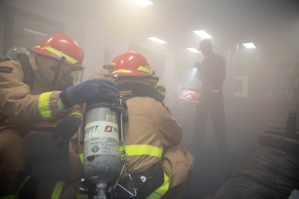 CS1 Stone Simulates a Fire as Sailors Respond