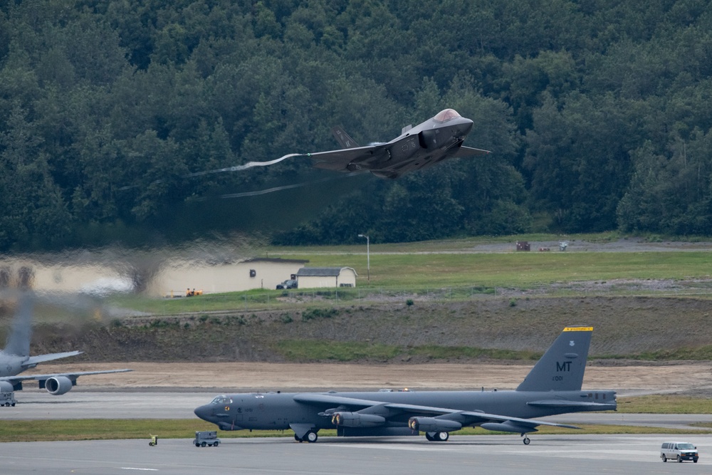 B-52s and 5th-Gen Fighters conduct training sorties above Alaska