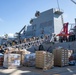 USS Ralph Johnson conducts stores onload.