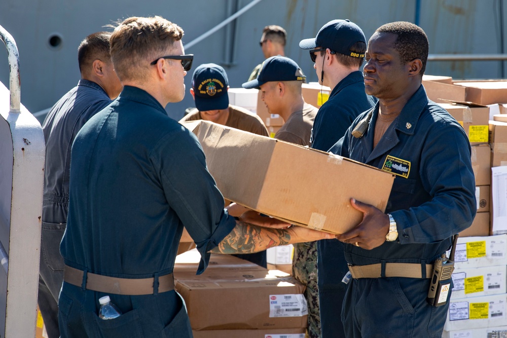 USS Ralph Johnson conducts stores onload.
