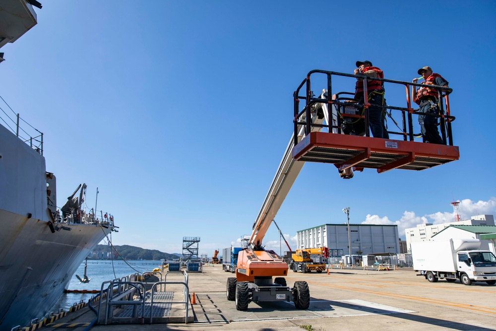 USS Ralph Johnson Sailors conduct paint preservation.