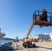 USS Ralph Johnson Sailors conduct paint preservation.