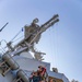 USS Ralph Johnson Sailors conduct paint preservation.