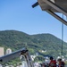 USS Ralph Johnson Sailors conduct paint preservation.