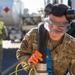 USAF Airmen and RAAF aviator refuel F-22 Raptors