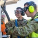 USAF Airmen and RAAF aviator refuel F-22 Raptors