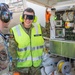 USAF Airmen and RAAF aviator refuel F-22 Raptors