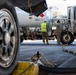 USAF Airmen and RAAF aviator refuel F-22 Raptors