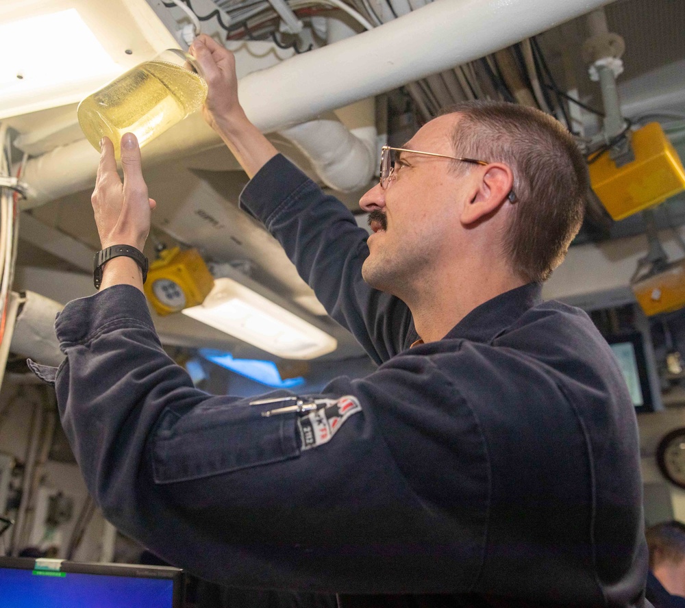 Lt. Scott Inspects Fuel Sample