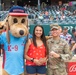 Outstanding Airman winner throws first pitch