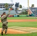 Outstanding Airman winner throws first pitch
