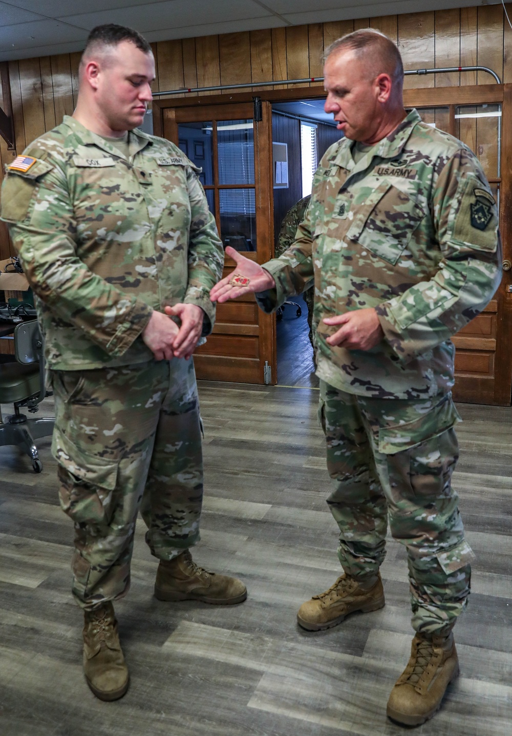 213th RSG Command Sergeant Major Recognizes 110th CSSB Soldier's Excellence with CSM Coin