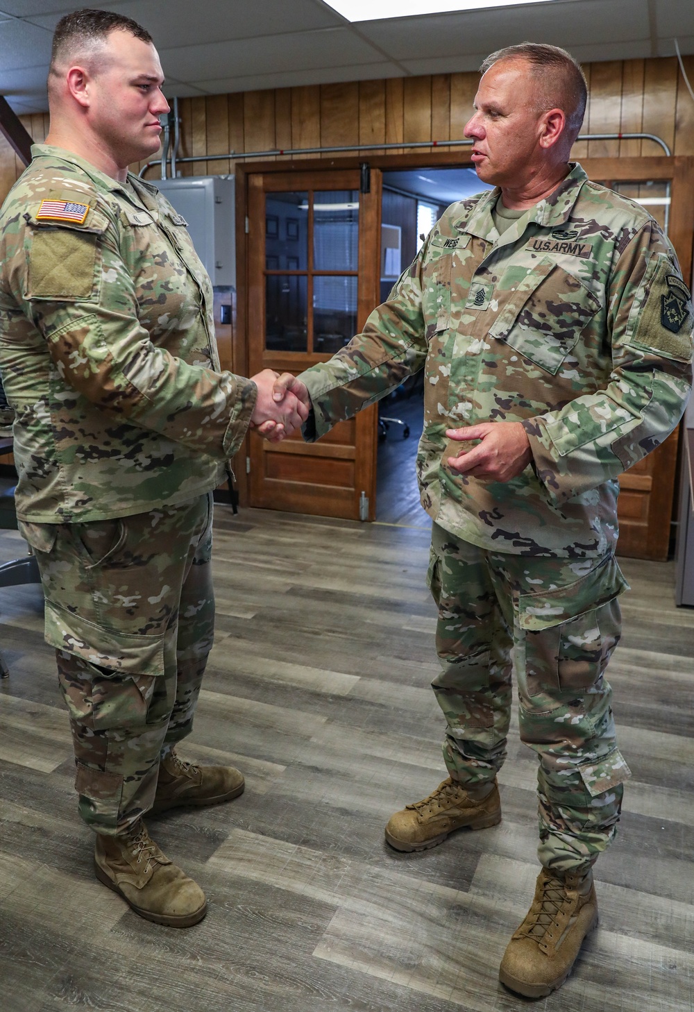 213th RSG Command Sergeant Major Recognizes 110th CSSB Soldier's Excellence with CSM Coin