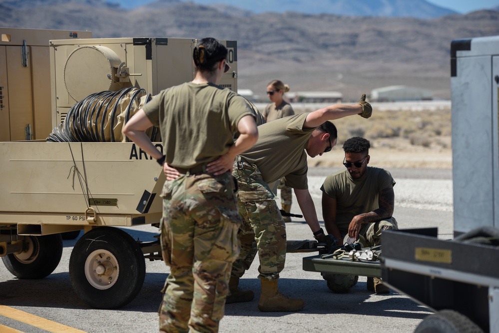 Marine C-130 at Creech; loading equipment and Airmen