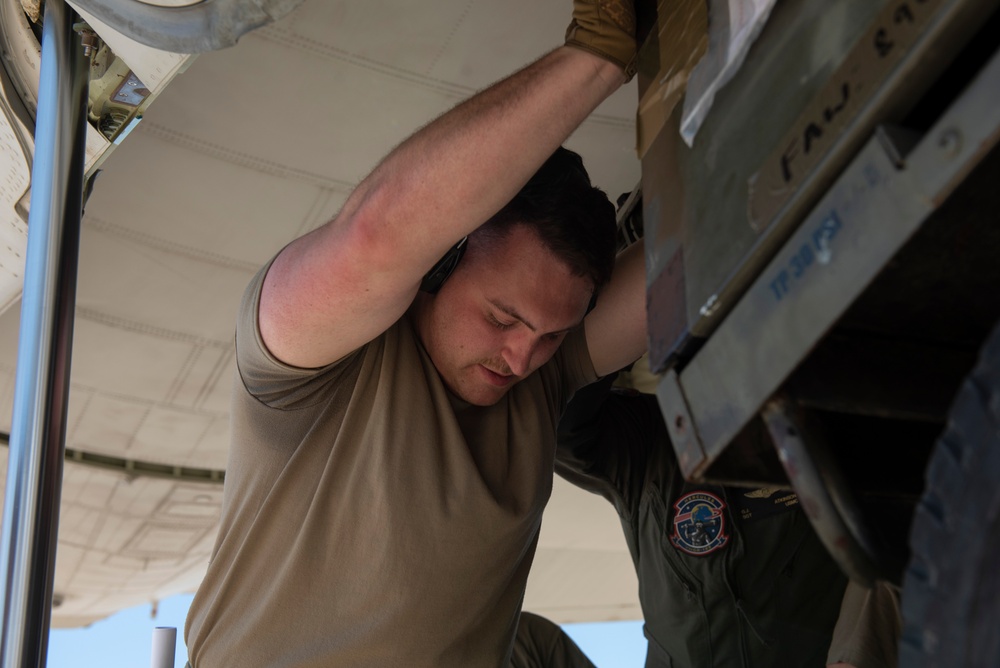 Marine C-130 at Creech; loading equipment and Airmen