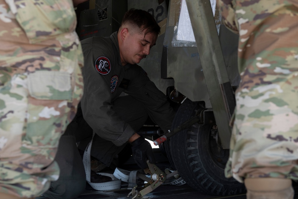 Marine C-130 at Creech; loading equipment and Airmen