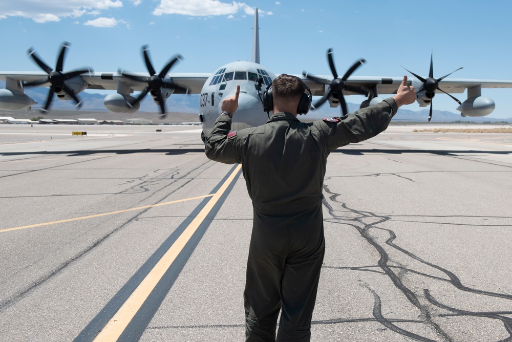 Marine C-130 at Creech; loading equipment and Airmen