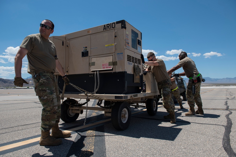 Marine C-130 at Creech; loading equipment and Airmen