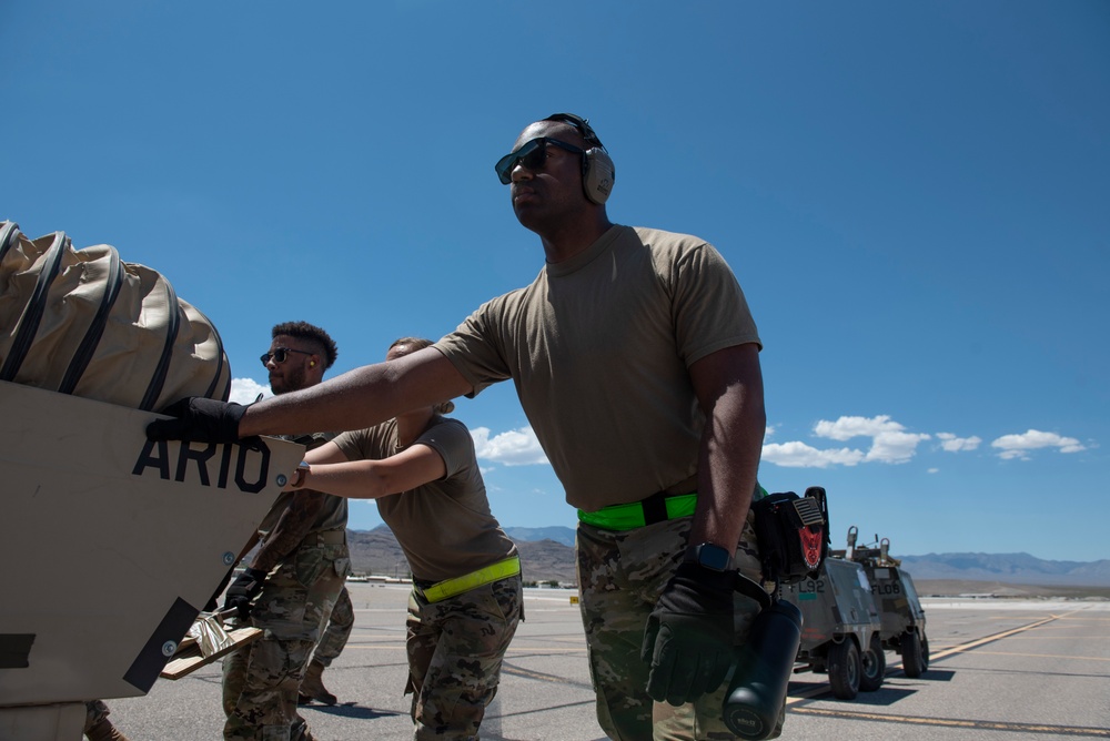 Marine C-130 at Creech; loading equipment and Airmen